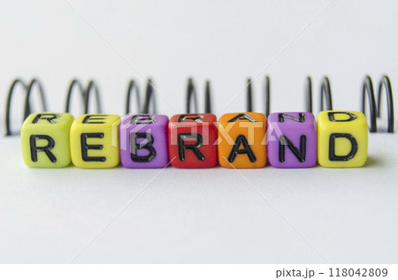 Close up of BRANDING text representing on small square toy on white background 118042809