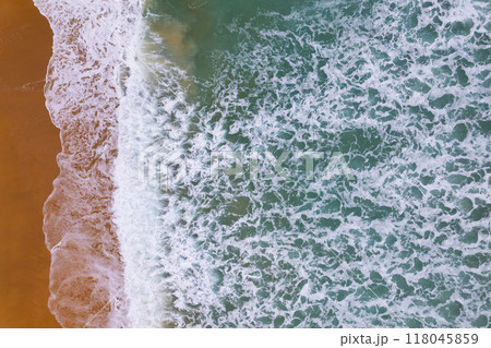 Beautiful sea beach and waves texture in sunny summer day background 118045859