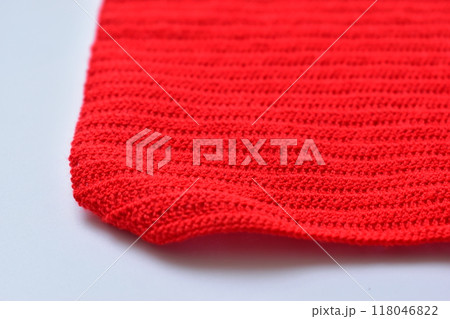 red wool knitted yarn texture, woolen fabric on white background red wool knitted yarn texture, woolen fabric on white background 118046822
