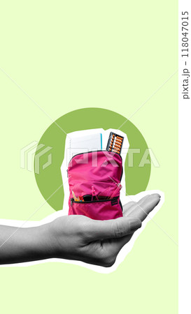 A hand holding a pink purse with a green background 118047015
