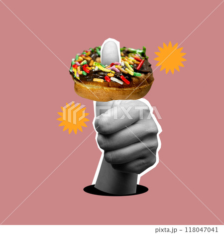 A hand holding a doughnut with sprinkles on it 118047041