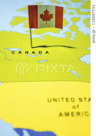 A map of Canada with a Canadian flag on it A map of Canada with a Canadian flag on it 118047531