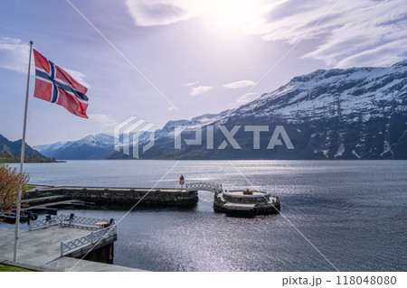 Norwegian Fjord with Flag and Pier. Norwegian Fjord with Flag and Pier. 118048080