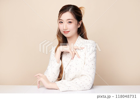 Beautiful young asian woman with clean fresh skin on beige background, Face care, Facial treatment, Cosmetology, beauty and spa, Asian women portrait. 118048731