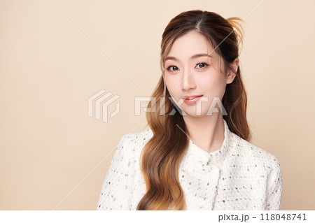 Beautiful young asian woman with clean fresh skin on beige background, Face care, Facial treatment, Cosmetology, beauty and spa, Asian women portrait. 118048741