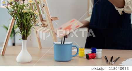 Art supplies arranged in a creative workspace 118048958