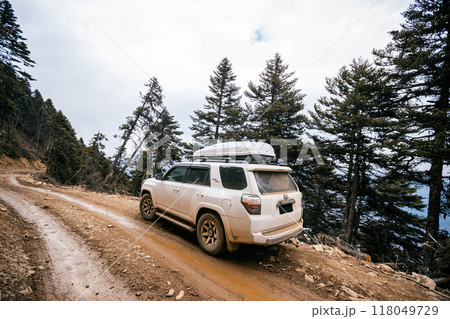 Offroad car driving on mountain road in tibet,China 118049729