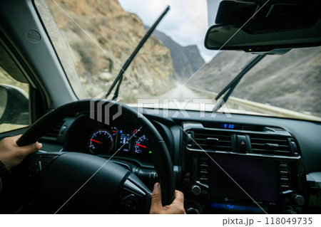Driving car on the high altitude mountain trail in tibet,China 118049735