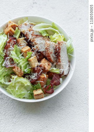 A bowl  of  Caesar salad 118050005