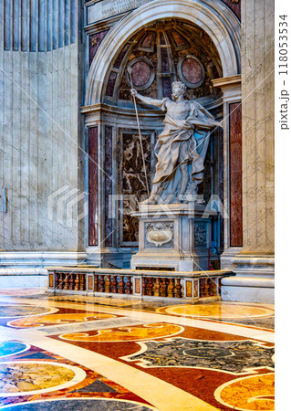 The statue of Saint Longinus, created by Bernini, stands prominently in Saint Peter's Basilica, showcasing intricate details and dynamic posture within a majestic architectural setting. 118053534