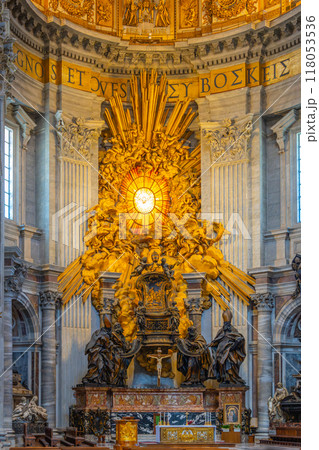 The apse of St. Peter's Basilica displays St. Peter's Cathedra, surrounded by the four Doctors of the Church, showcasing incredible artistry and gold detailing. 118053536