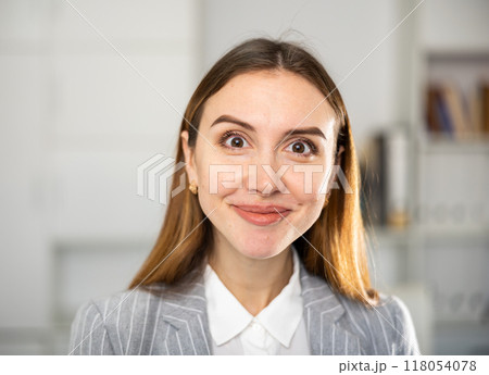 Portrait of female manager with different emotions on her face in modern office 118054078