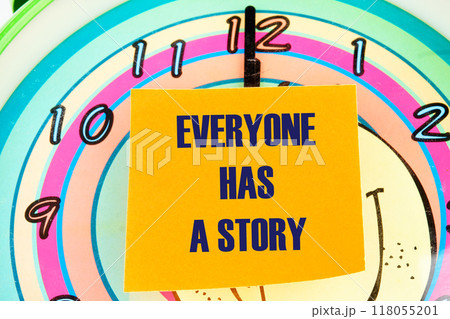 Business, technology, internet concept. EVERYONE HAS A STORY message written on the sticker on the background of the clock face with hands 118055201