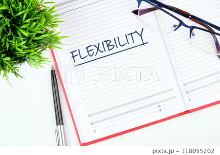 Business flexibility concept. Copy space. Flexibility symbol. Concept word Flexibility in the business notebook 118055202