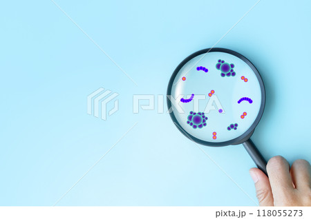 Hand holding magnifying glass focus plus and virus icon to healthcare medical on blue background. health insurance concept and access to welfare. medical technology. 118055273