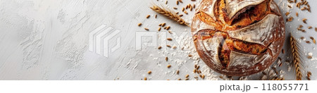 A freshly baked loaf of bread with a crusty exterior, surrounded by flour, wheat kernels, and a wheat stalk on a white background. Generative AI 118055771