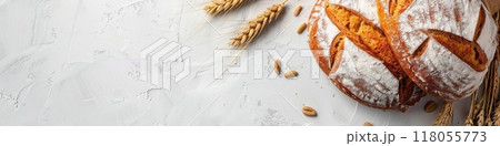 A freshly baked wheat bread loaf with wheat sprouts on a white background. Generative AI 118055773