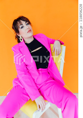 Beautiful Fashionable Young Woman In Pink Business suit Beautiful Fashionable Young Woman In Pink Business suit 118056220