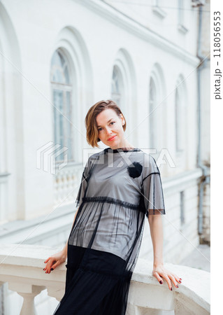 Beautiful woman of 40 years old walking through the streets of the city 118056553