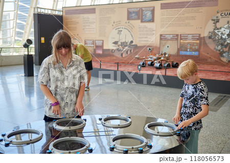 Young Explorers Engaged in Interactive Learning at Valencia's Science Museum Exhibit in the City of Arts and Sciences. Children Discovering Scientific Wonders Inside Valencia's Renowned Natural Young Explorers Engaged in Interactive Learning at Valencia's Science Museum Exhibit in the City of Arts and Sciences. Children Discovering Scientific Wonders Inside Valencia's Renowned Natural 118056573