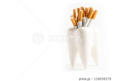 Cigarette in teeth model isolated on white background with copy space, damage health. 118056579