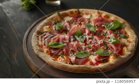 Close-up of fresh baked Italian pizza on old rustic kitchen table with ingredients Close-up of fresh baked Italian pizza on old rustic kitchen table with ingredients 118056957