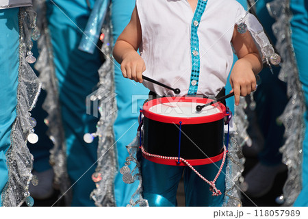 Carnival music played on drums by colorfully dressed musicians Carnival music played on drums by colorfully dressed musicians 118057989
