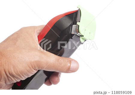 Hair clipper in a man's hand Hair clipper in a man's hand 118059109