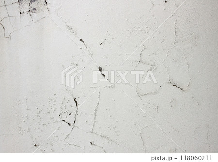 Cracked and swollen cement walls with moisture-induced mold as a background 118060211