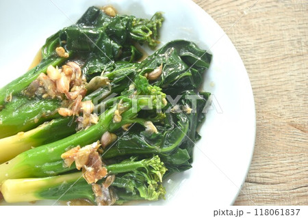 fried Kailaan Chinese kale dressing oyster sauce with chop garlic on plate fried Kailaan Chinese kale dressing oyster sauce with chop garlic on plate 118061837