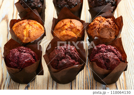 Mix of muffins ( cupcake ) chocolate , vanilla , berries . Top view 118064130