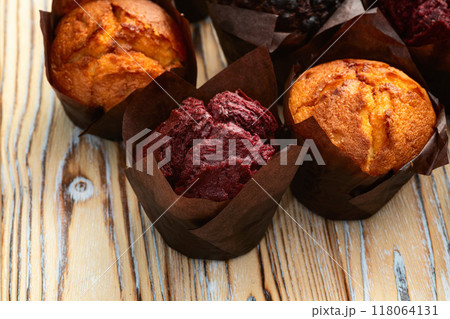 Mix of muffins ( cupcake ) chocolate , vanilla , berries . Top view 118064131