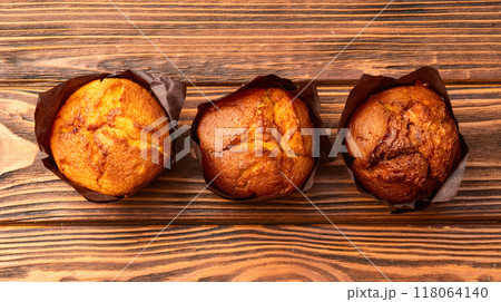 Sweet Baked vanilla muffins ( cupcake )  . Top view 118064140