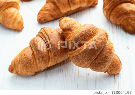 Group of sweet croissant . French morning breakfast . Top view Group of sweet croissant . French morning breakfast . Top view 118064198