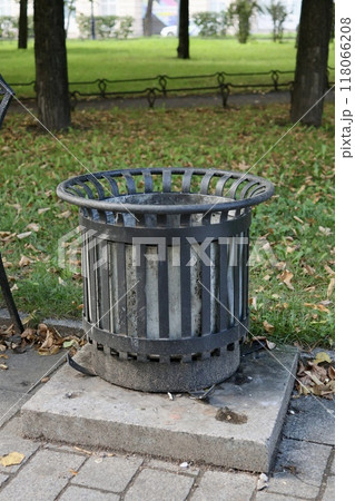 public trash can on city street filled with garbage. plastic waste in trash can container. public trash can on city street filled with garbage. plastic waste in trash can container. 118066208