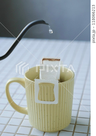yellow cup freshly brewed coffee with convenient drip filter on table. prepare freshly brewed coffee yellow cup freshly brewed coffee with convenient drip filter on table. prepare freshly brewed coffee 118066213