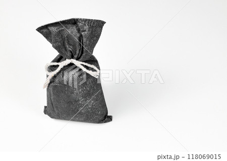 air purify charcoal bag, activated carbon moisture absorber and odor eliminator bag for maintain freshness and clear smell isolated on white background. air purify charcoal bag, activated carbon moisture absorber and odor eliminator bag for maintain freshness and clear smell isolated on white background. 118069015