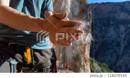 Man climbs with magnesium powder, hands closeup. Man climbs with magnesium powder, hands closeup. 118070584