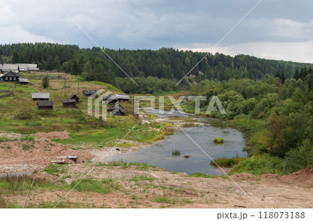 Village on the bank of a small river Village on the bank of a small river 118073188