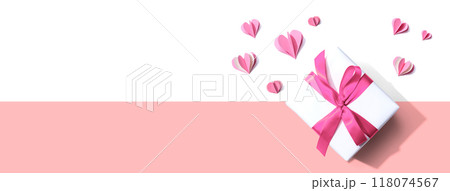 Gift box with pink paper hearts Gift box with pink paper hearts 118074567