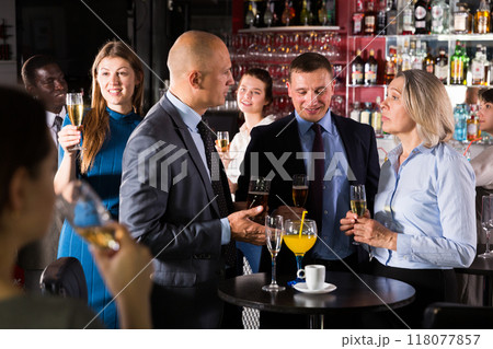 Men and woman at corporate party Men and woman at corporate party 118077857