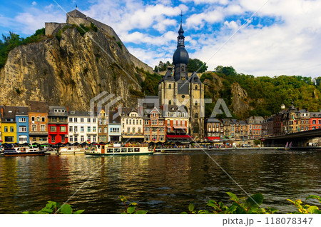 Residential buildings and Notre Dame de Dinant along Meuse River 118078347