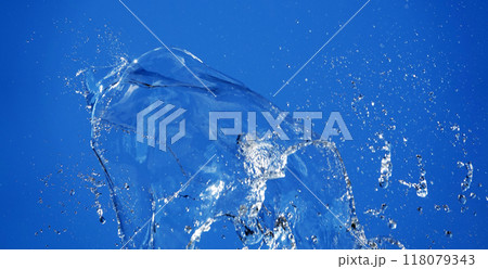 Background - Water in flight on a blue background takes on a variety of unique and bizarre shapes Background - Water in flight on a blue background takes on a variety of unique and bizarre shapes 118079343