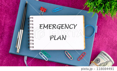 Conceptual emergency plan symbol. Copy space. Emergency plan words written in a notebook in front of an abstract background. 118084491