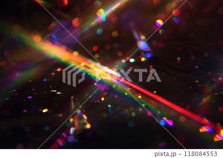 Abstract Colorful Light Beams and Bokeh overlay with Sparkling Particles on Dark Background 118084553