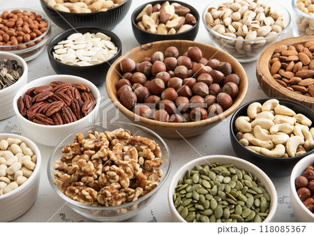 Bowls with hazelnut,walnut,pecan,almonds,peanut,sunflower and pumpkin seeds.healthy diet snack. 118085367