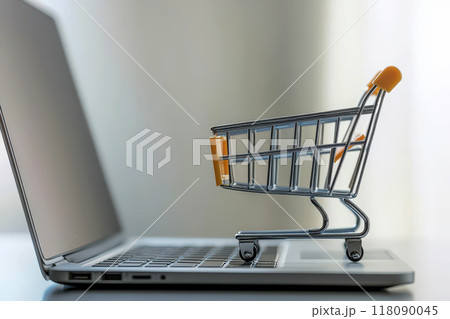 Online shopping e-commerce and customer experience concept. Cute Shopping cart on a laptop keyboard, depict shopper consumers buy or purchase goods and services at home or office 118090045