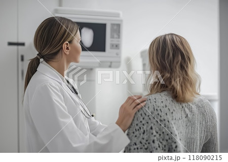 Female doctor comforting patient during medical consultation about a mammography scan results 118090215