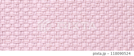 Texture light pink background from woven textile material with wicker pattern, macro. Vintage rose fabric cloth 118090524