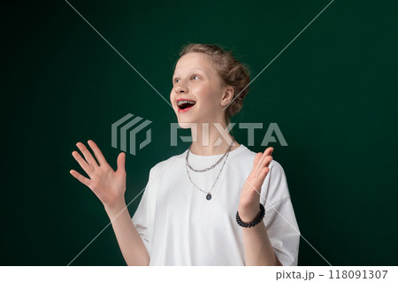 Woman in White Shirt Holding Out Hands Woman in White Shirt Holding Out Hands 118091307